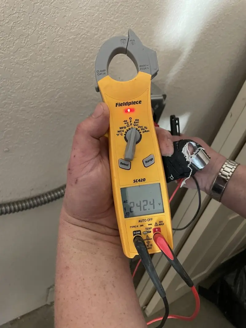 Voltage testing with clamp meter during Circuit Breaker Repair in Paulding
